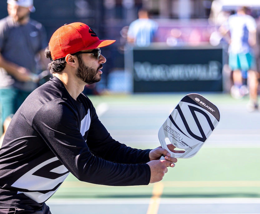 A profile image shows a man playing pickleball outdoors. He wears a baseball cap and plays with a Selkirk VANGUARD Power Air. 