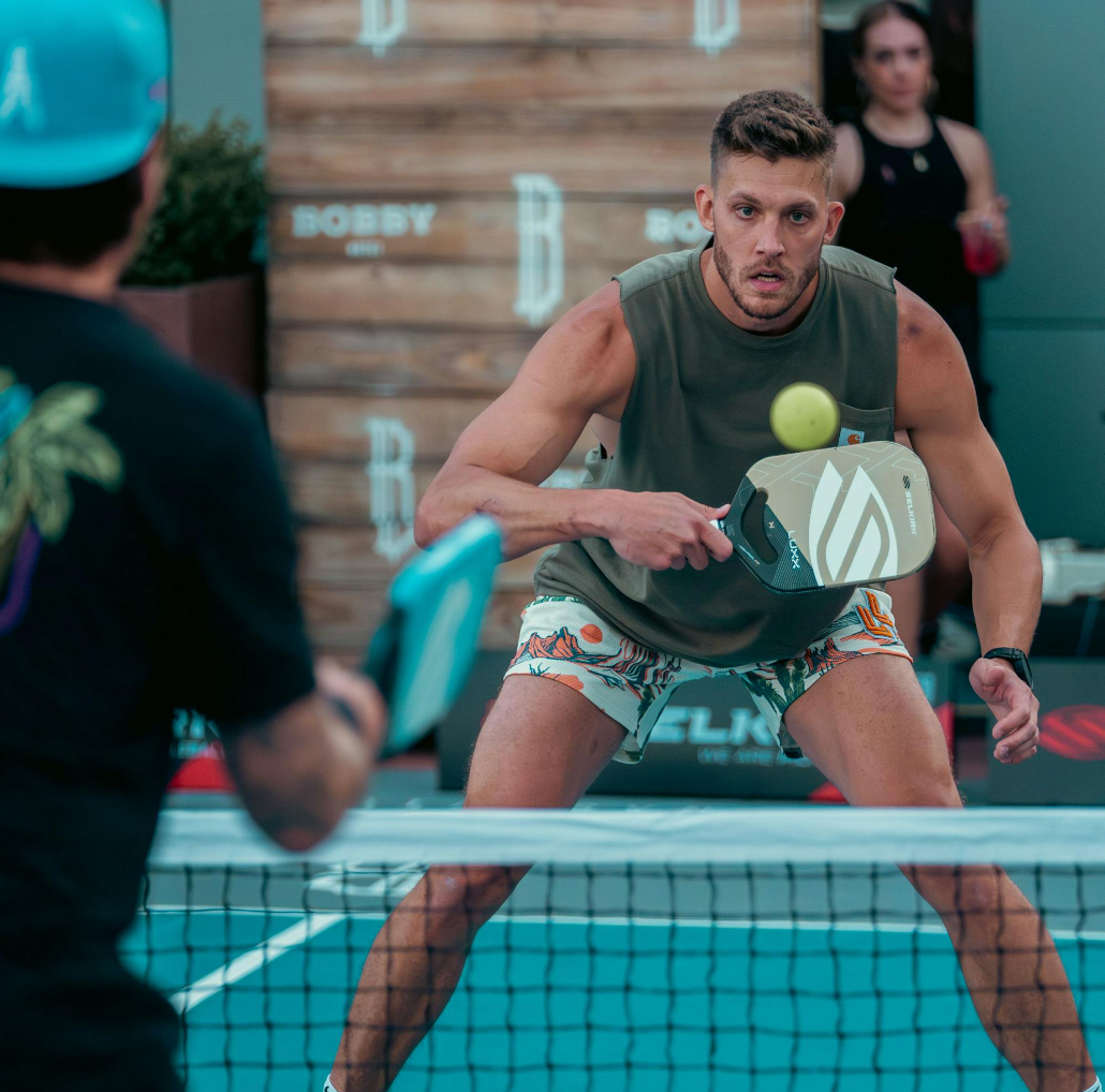 Meyers Leonard hits a volley with his Selkirk Luxx Control Air pickleball paddle. 