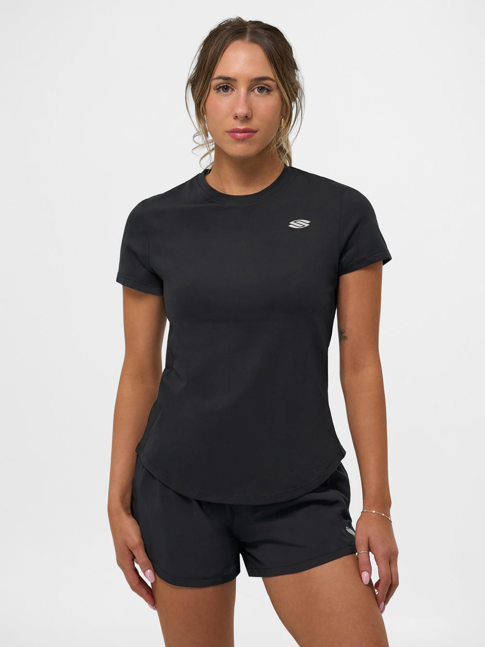 Selkirk pickleball women's training tshirt in black, white, and blue.